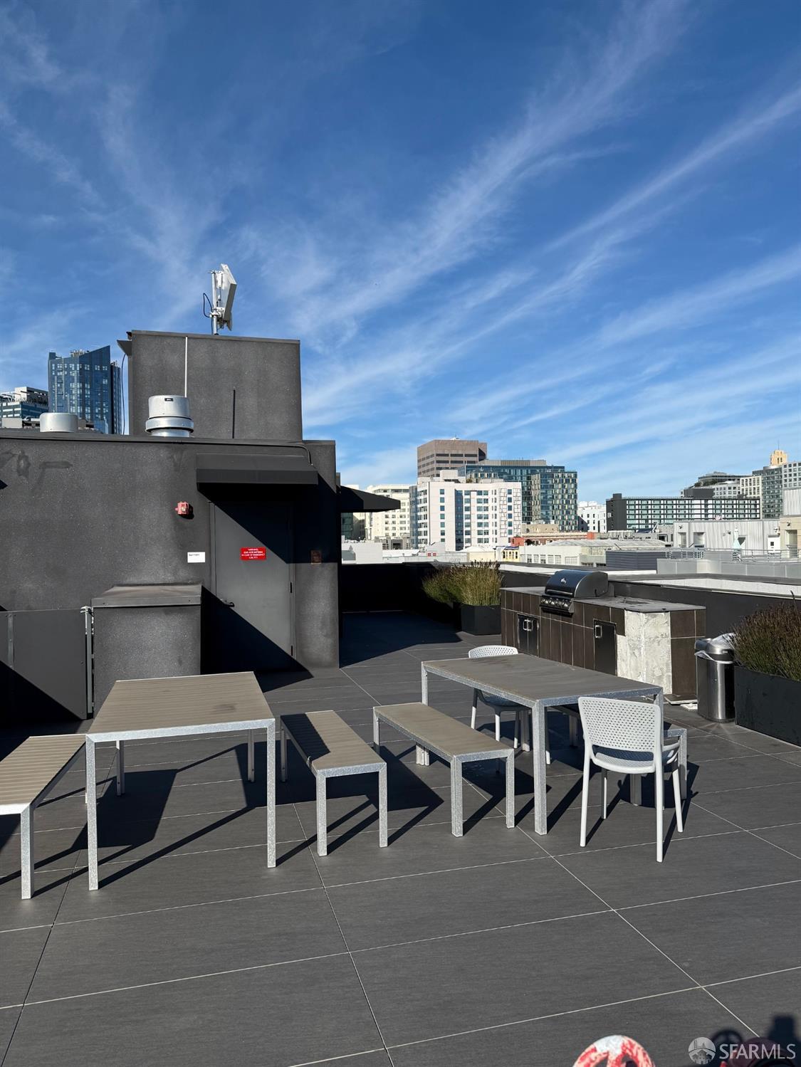241 10th Street, Unit 305 San Francisco, CA 94103 - Photo 15 of 16 a view of a chairs and tables in a terrace