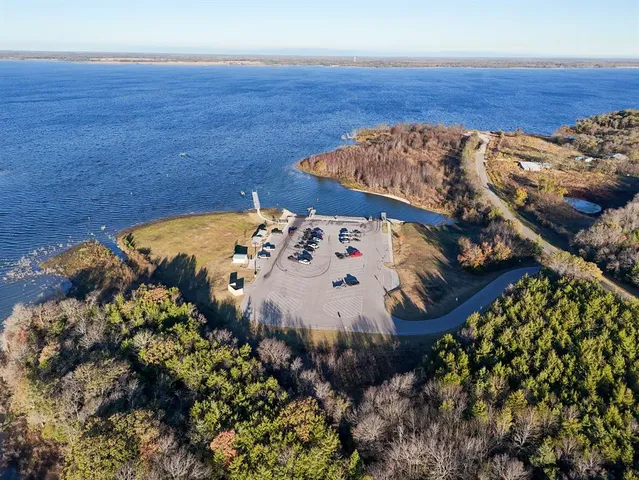 a living room with lots of furniture and a large window