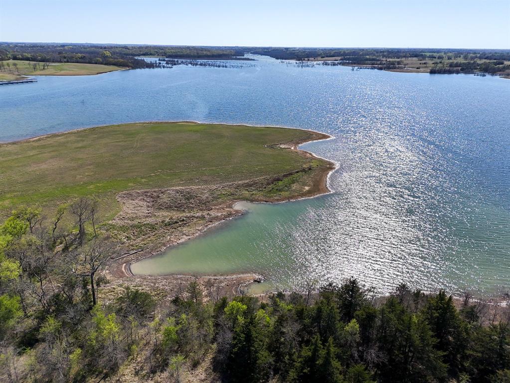 0 Lakeshore Terrace Windom, TX 75492 - Photo 28 of 35 a view of a lake with a yard