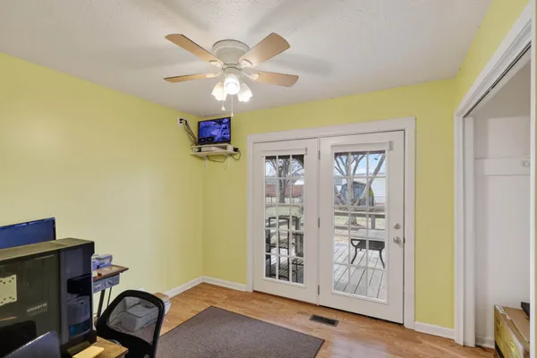 a view of a livingroom with furniture and cabinet