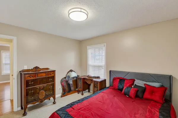 a bedroom with two beds and a closet