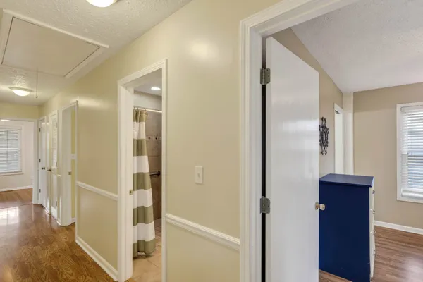 a view of a bathroom with wooden floor