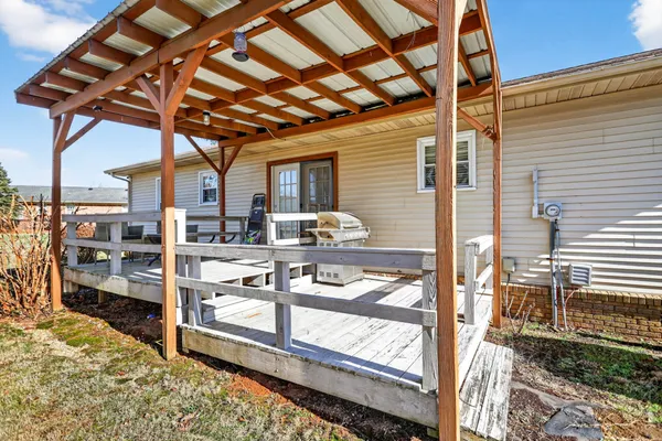 a view of a chair and tables in the balcony
