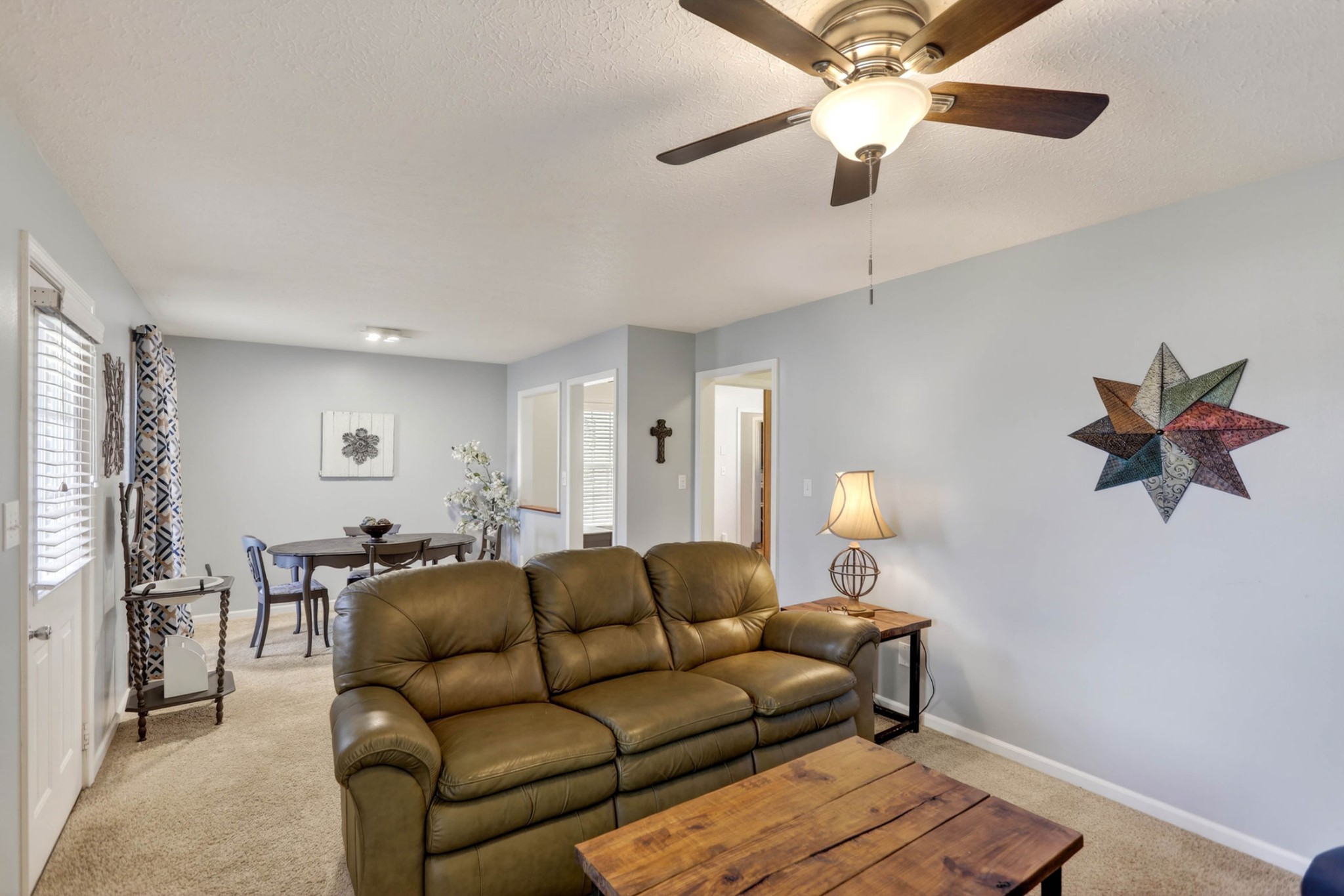 257 North Fairway Road Franklin, KY 42134 - Photo 9 of 30 a living room with furniture a chandelier fan and a window