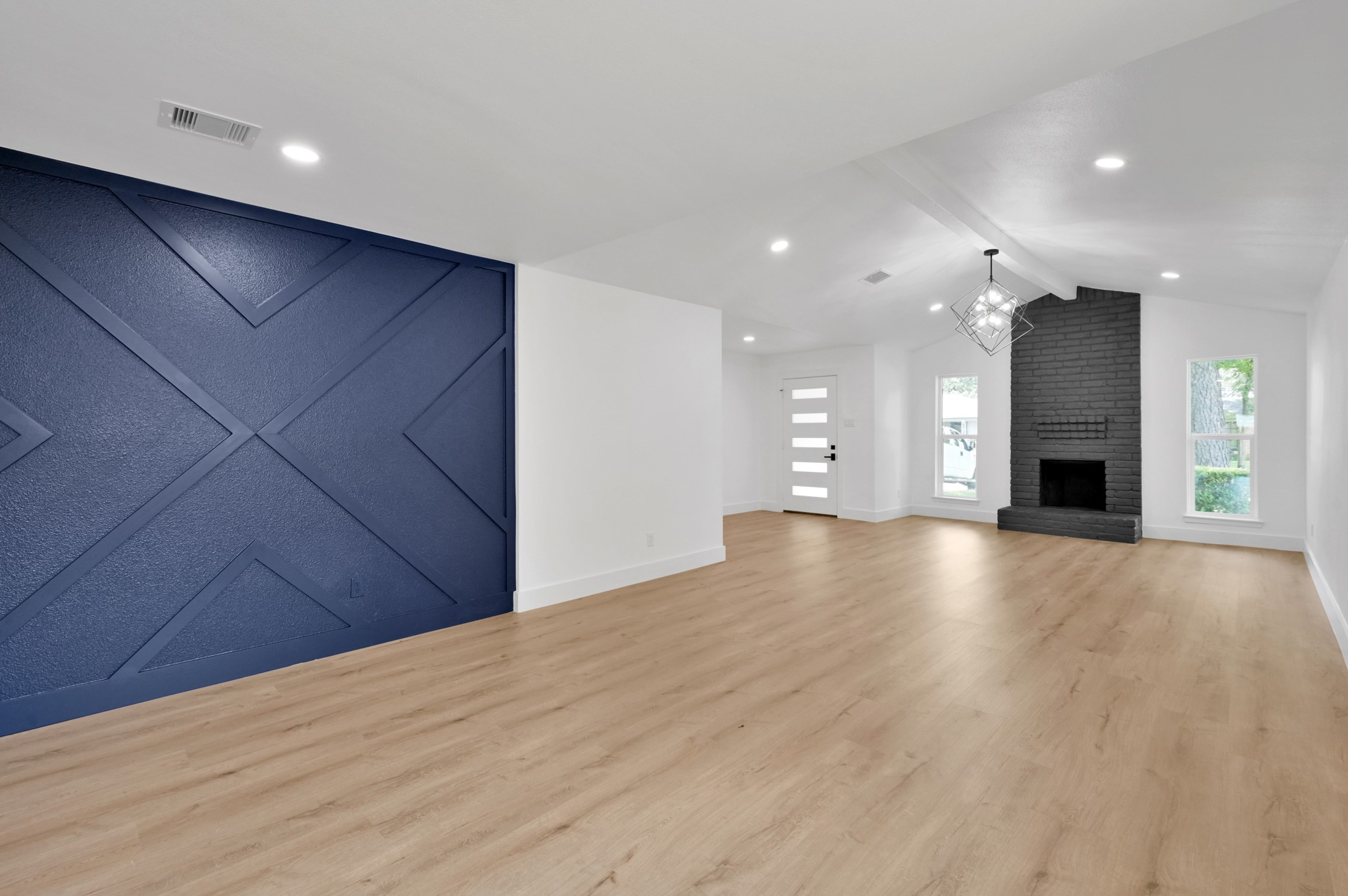 5015 Monteith Drive Spring, TX 77373 - Photo 13 of 44 a view of empty room with a kitchen and fireplace