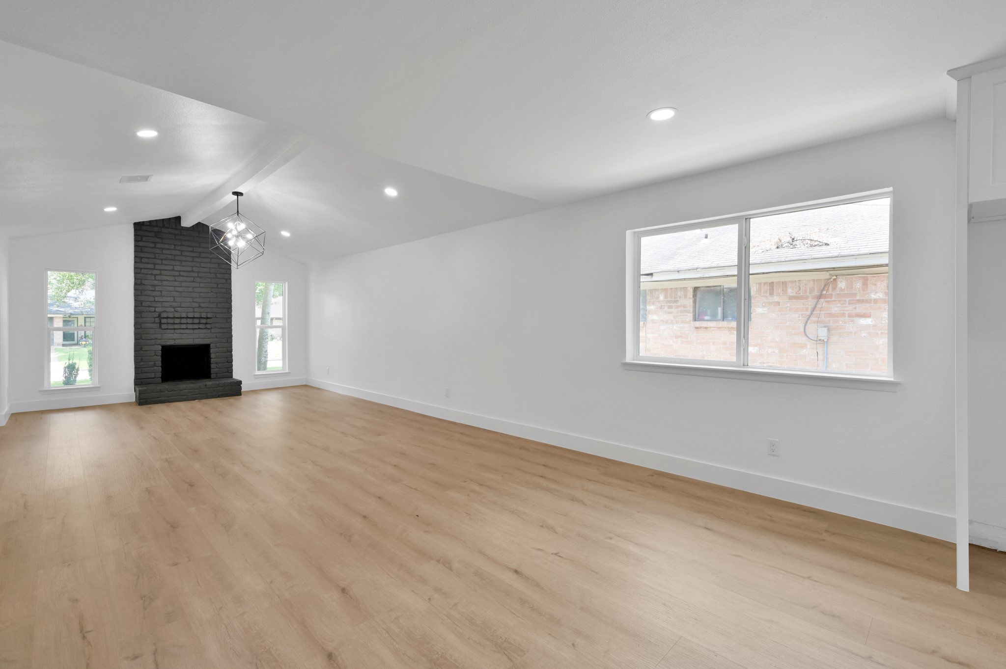 5015 Monteith Drive Spring, TX 77373 - Photo 14 of 44 an empty room with wooden floor and windows
