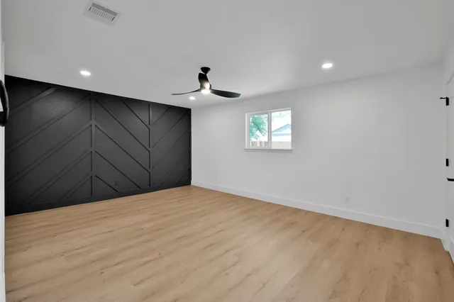 a view of an empty room with windows