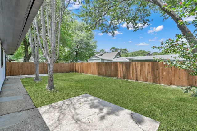 a view of a backyard with a garden