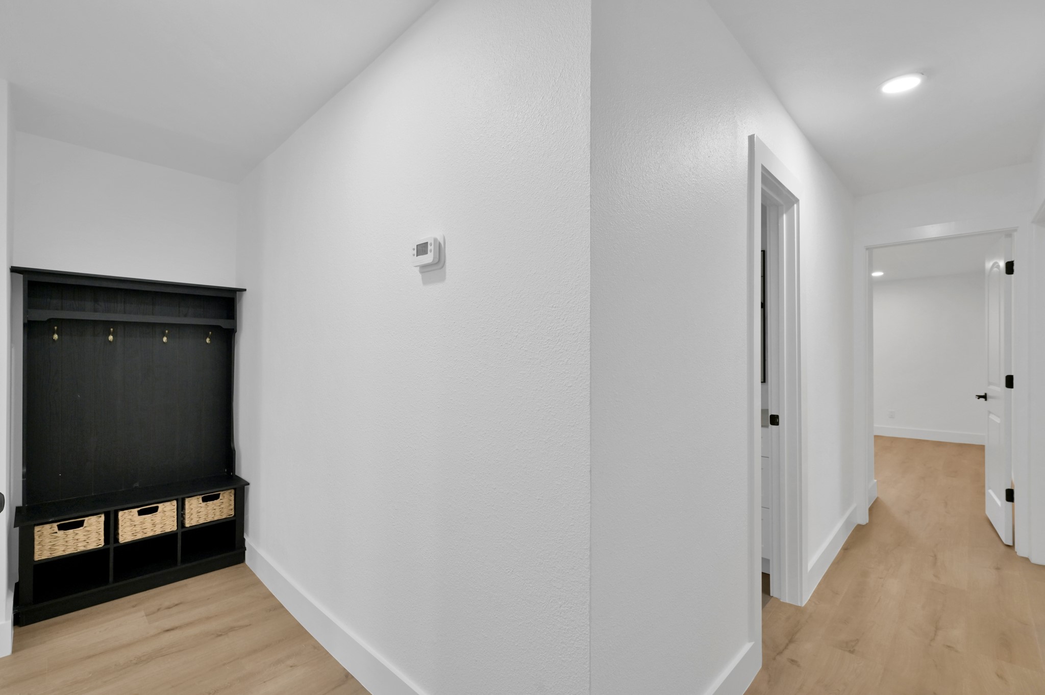5015 Monteith Drive Spring, TX 77373 - Photo 8 of 44 a view of a hallway with wooden floor and staircase