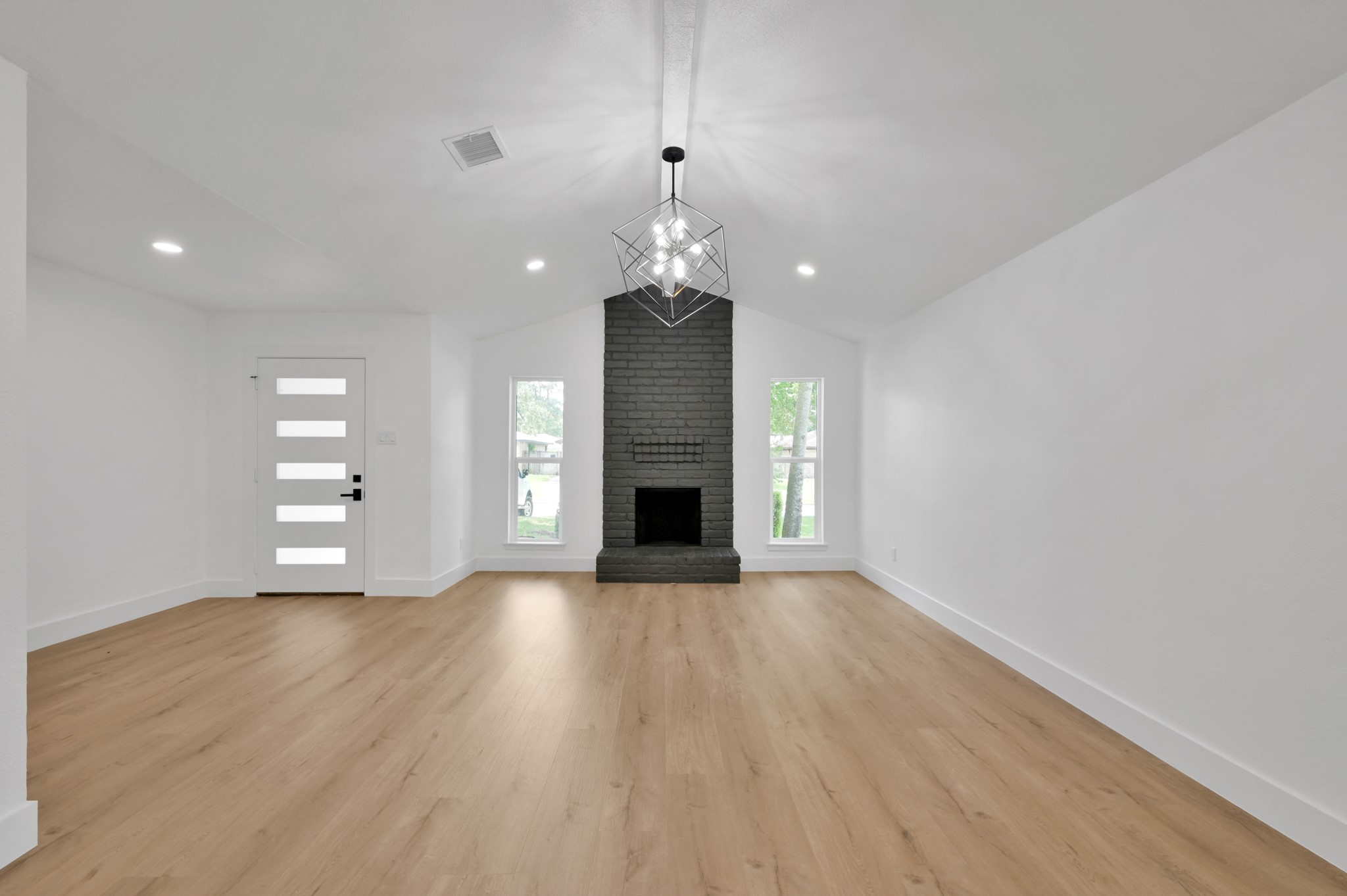 5015 Monteith Drive Spring, TX 77373 - Photo 10 of 44 a big room with wooden floor fireplace and windows