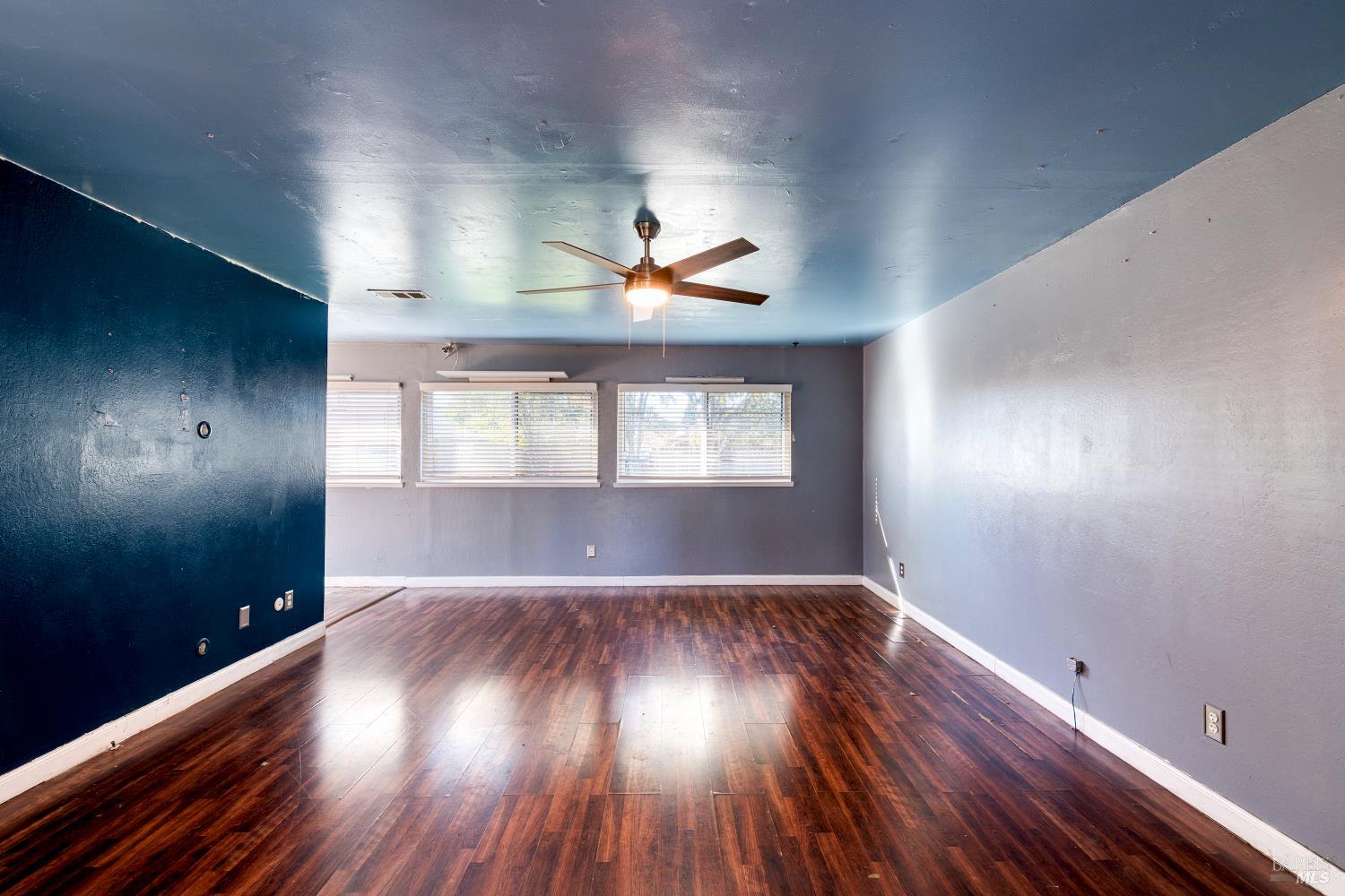 7517 Bobbie Way Rohnert Park, CA 94928 - Photo 5 of 18 wooden floor in an empty room with a window
