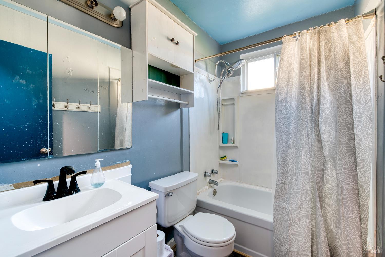 7517 Bobbie Way Rohnert Park, CA 94928 - Photo 9 of 18 a bathroom with a sink a toilet and shower