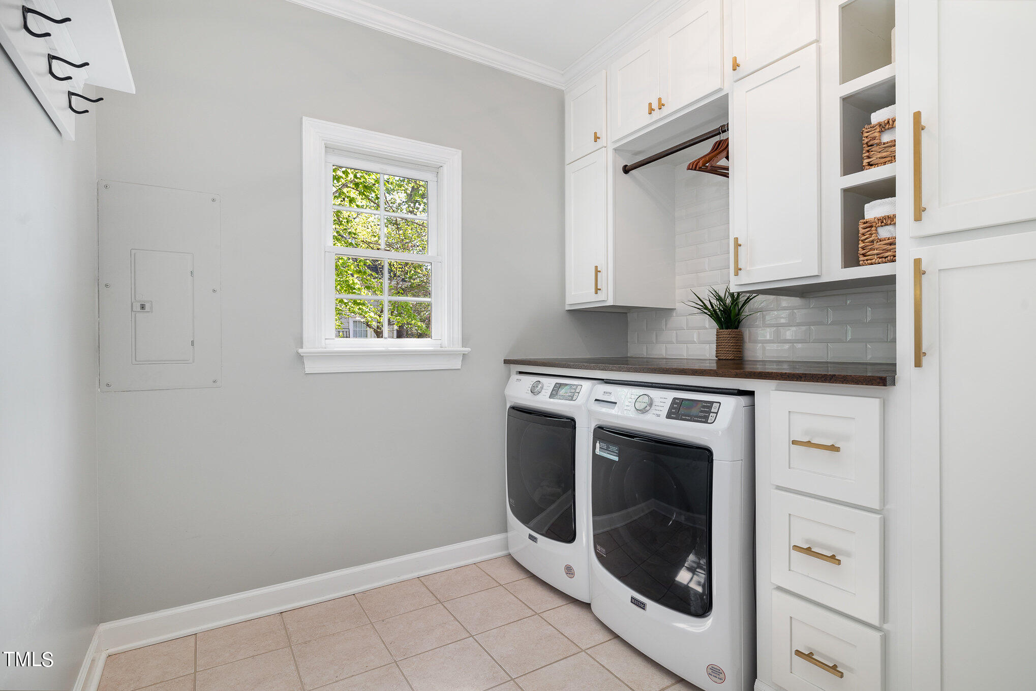 3705 La Costa Way Raleigh, NC 27610 - Photo 20 of 40 a kitchen with granite countertop a sink a washer and dryer