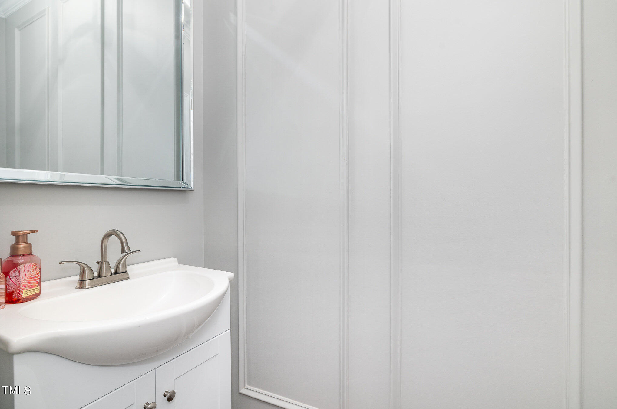 3705 La Costa Way Raleigh, NC 27610 - Photo 21 of 40 a bathroom with a sink and a mirror