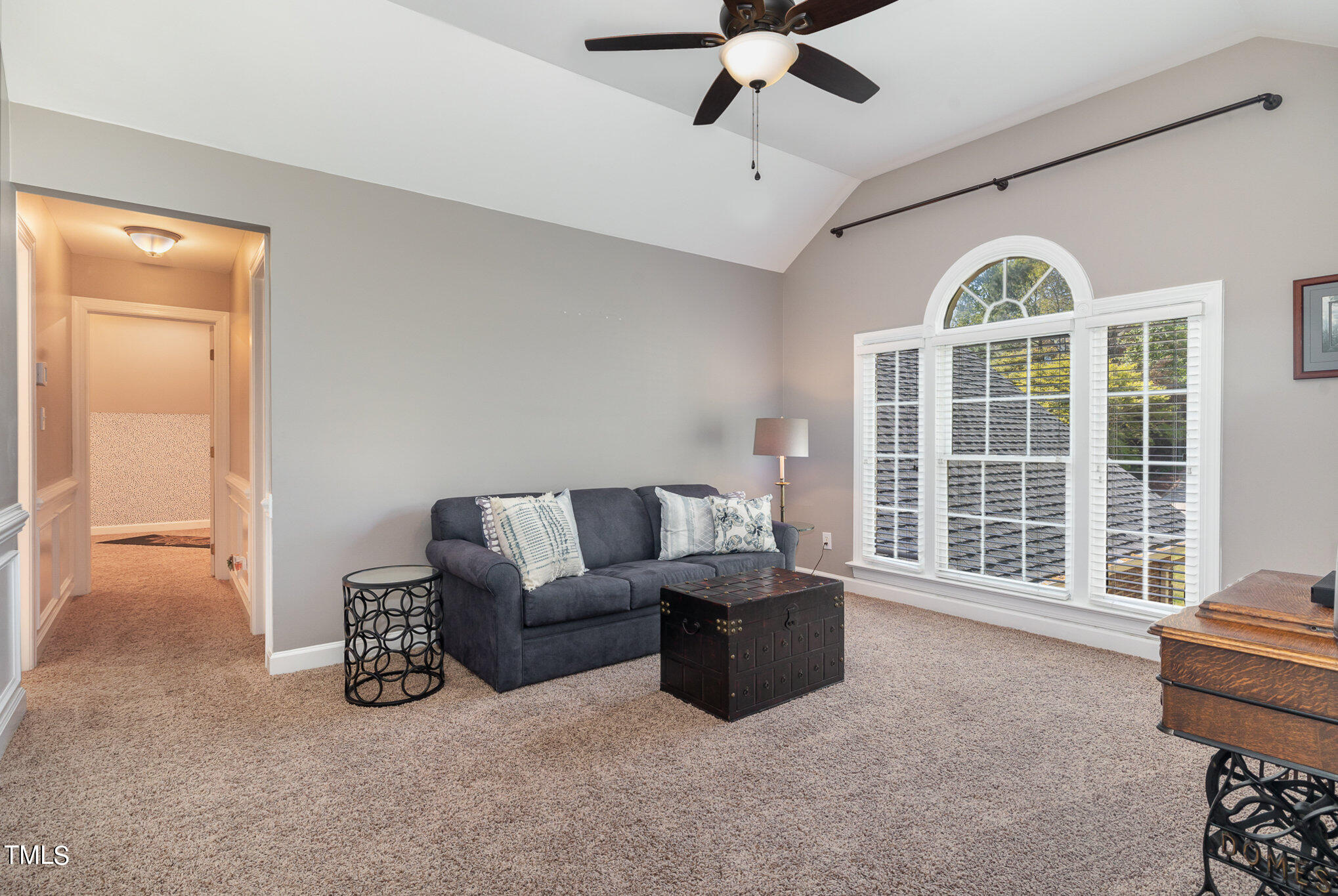 3705 La Costa Way Raleigh, NC 27610 - Photo 24 of 40 a living room with furniture a chandelier and a large window
