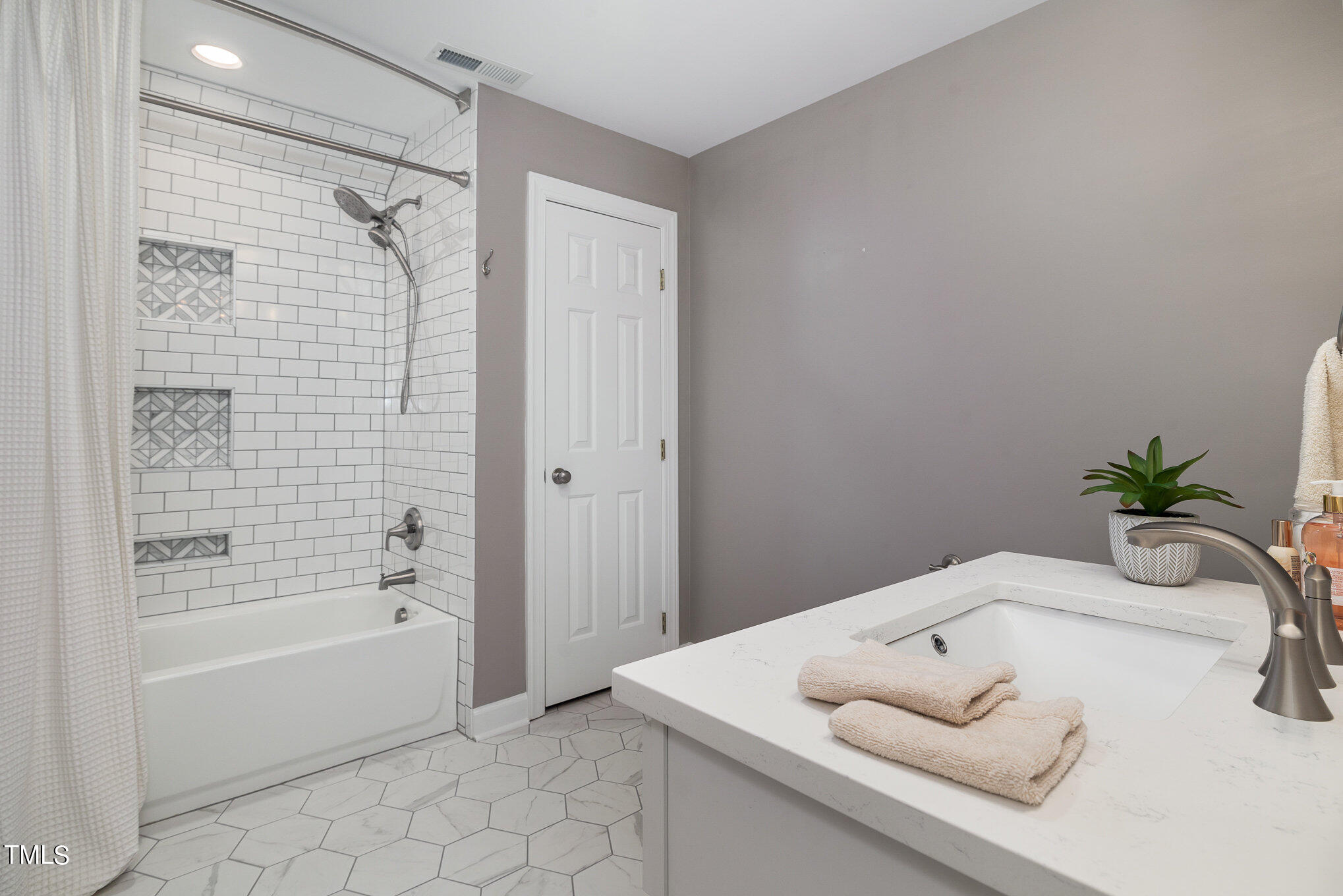3705 La Costa Way Raleigh, NC 27610 - Photo 25 of 40 a bathroom with a bathtub sink and shower
