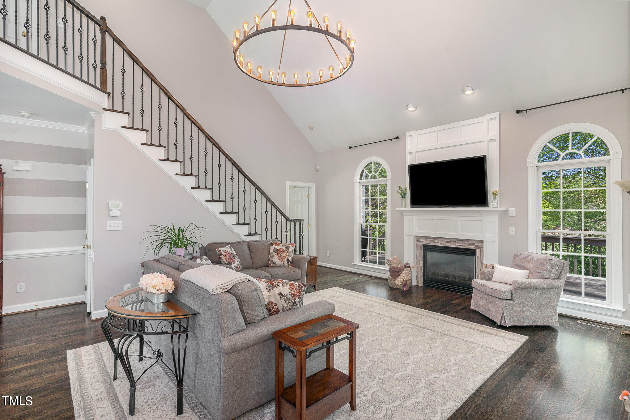 3705 La Costa Way Raleigh, NC 27610 - Photo 4 of 40 a living room with furniture a fireplace and a flat screen tv