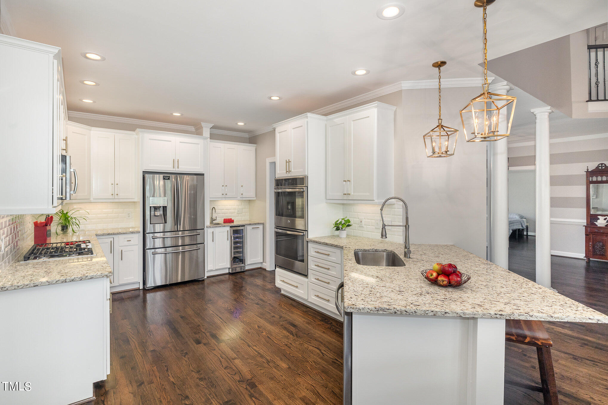 3705 La Costa Way Raleigh, NC 27610 - Photo 7 of 40 a kitchen with stainless steel appliances kitchen island granite countertop a refrigerator and a sink