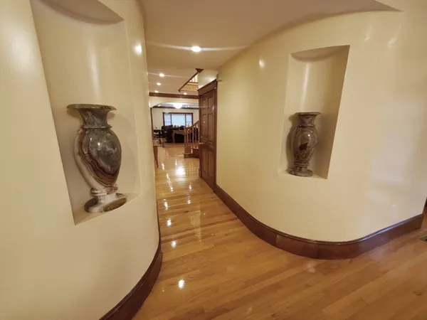 a bathroom with a granite countertop bathtub shower and toilet