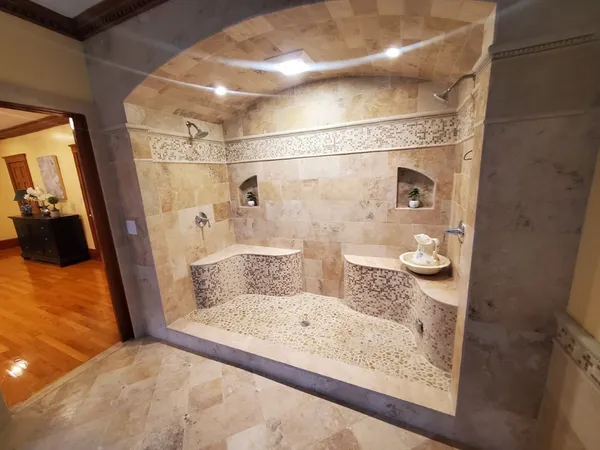 a view of an entryway with wooden floor