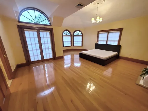 a view of a livingroom with furniture and a large window