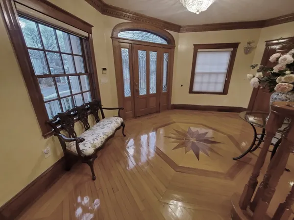 a bathroom with a sink mirror vanity and toilet