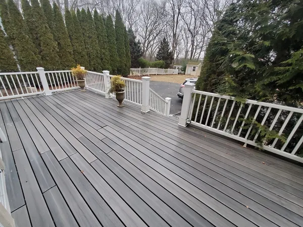a view of a livingroom with furniture and floor to ceiling window