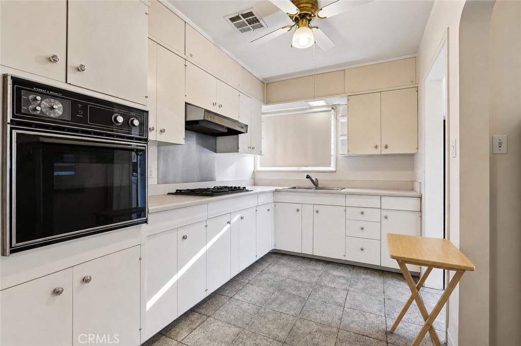 2209 Queensberry Road Pasadena, CA 91104 - Photo 15 of 44 a kitchen with granite countertop cabinets stainless steel appliances and a sink