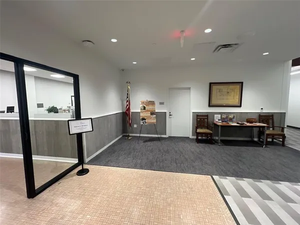 a living room with furniture and a rug