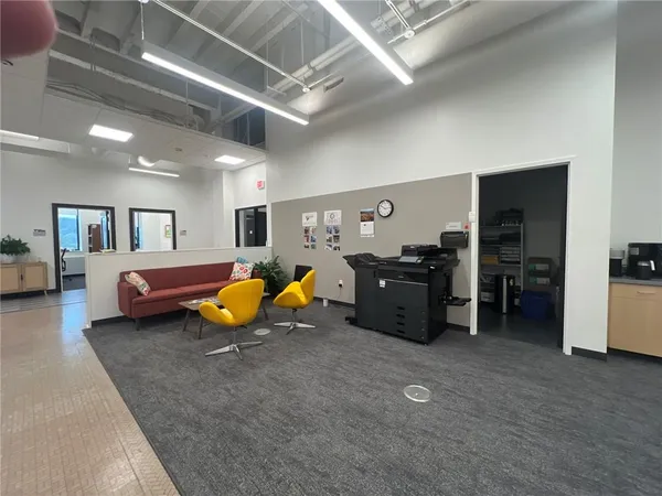 a bed room with furniture and gym equipment