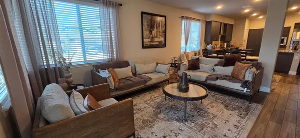 a living room with furniture and a large window