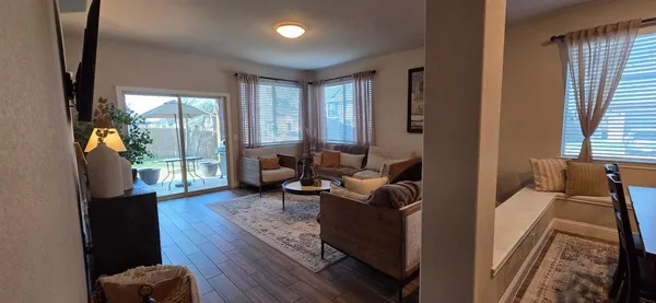 a living room with furniture and a large window