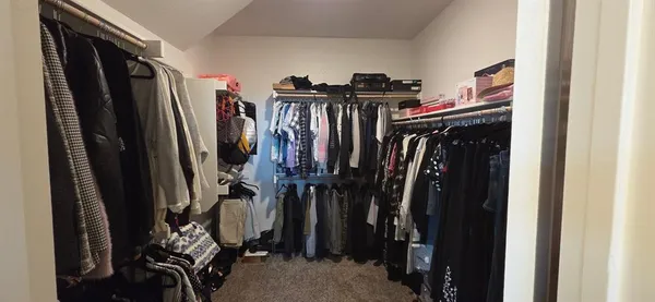 a view of an empty room with shelves