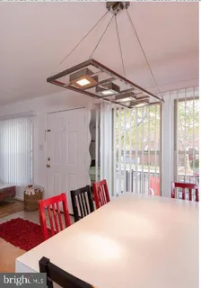 a very nice looking bedroom with a large bed and a chandelier