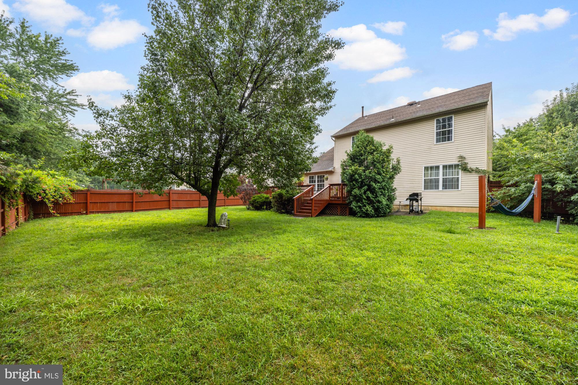338 Sapling Way Atco, NJ 08004 - Photo 33 of 34 a view of a house with backyard and a tree