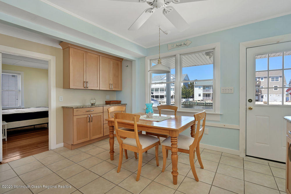 292 N Street, Unit A1 Seaside Park, NJ 08752 - Photo 16 of 31 a dining room with furniture and window