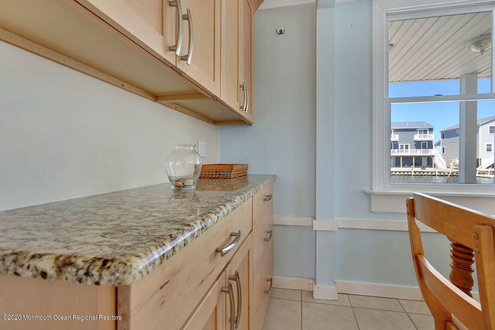 292 N Street, Unit A1 Seaside Park, NJ 08752 - Photo 22 of 31 a kitchen with a stove and a sink