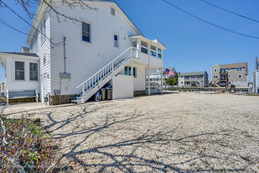 292 N Street, Unit A1 Seaside Park, NJ 08752 - Photo 23 of 31 a house with trees in front of it