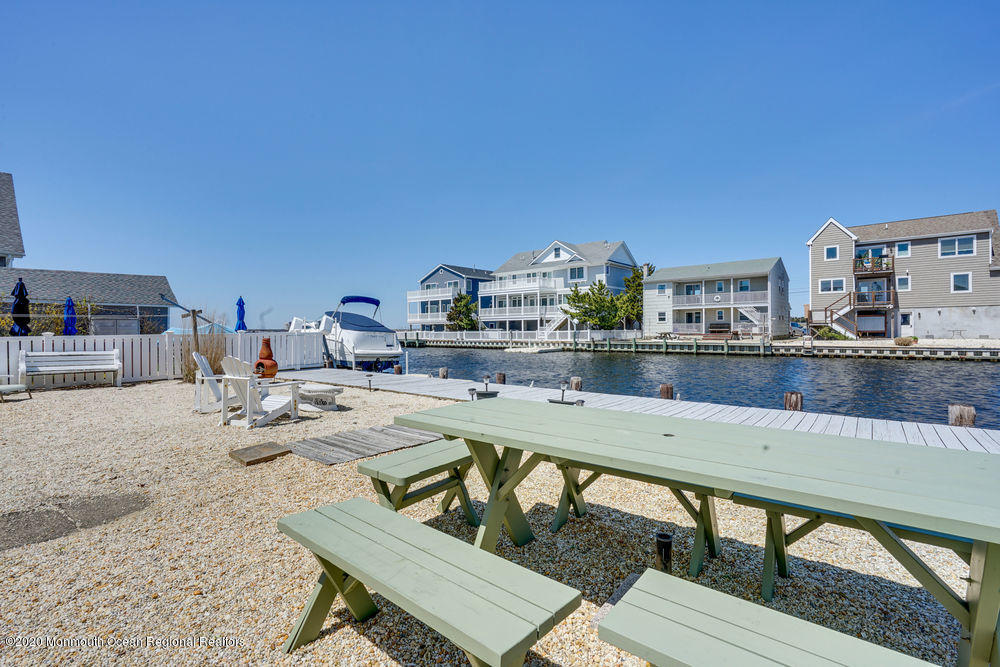 292 N Street, Unit A1 Seaside Park, NJ 08752 - Photo 24 of 31 a view of a swimming pool and lounge chair
