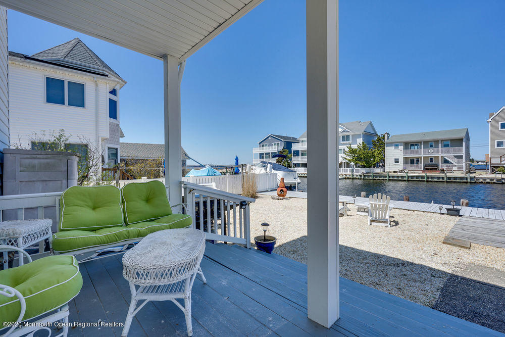 292 N Street, Unit A1 Seaside Park, NJ 08752 - Photo 30 of 31 a living room with furniture and a wooden floor