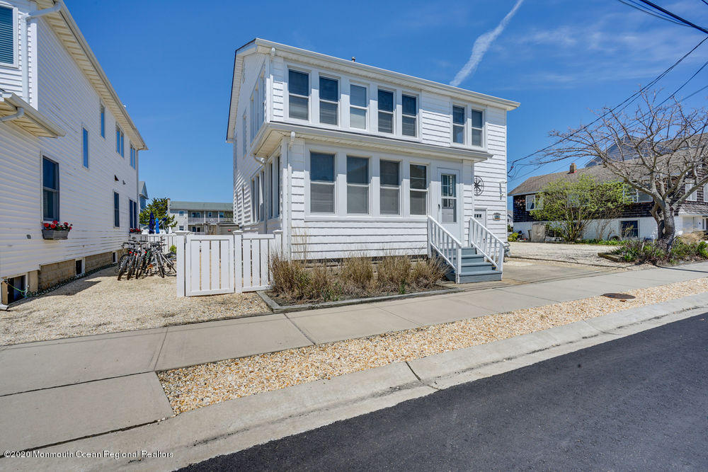 292 N Street, Unit A1 Seaside Park, NJ 08752 - Photo 4 of 31 a front view of a building with a road