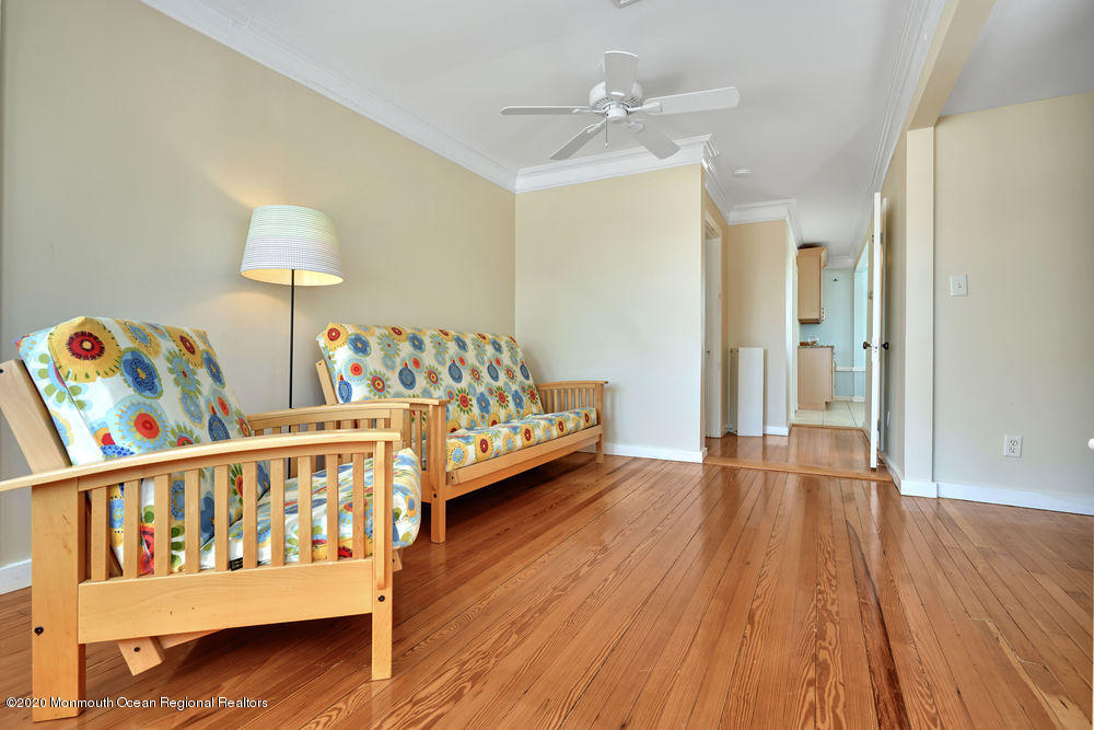 292 N Street, Unit A1 Seaside Park, NJ 08752 - Photo 6 of 31 a bedroom with furniture and wooden floor