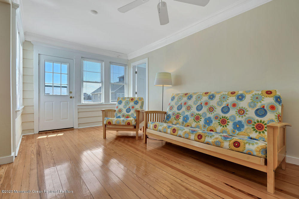 292 N Street, Unit A1 Seaside Park, NJ 08752 - Photo 8 of 31 a living room with furniture and a wooden floor