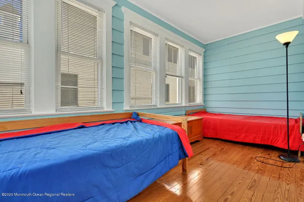 a bedroom with furniture and window