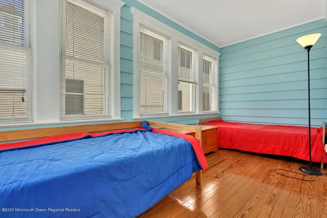 a bedroom with furniture and window