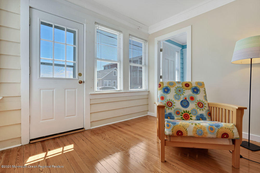 292 N Street, Unit A1 Seaside Park, NJ 08752 - Photo 10 of 31 a bedroom with furniture and window