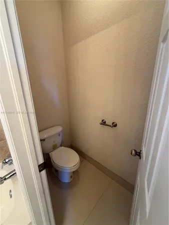 a bathroom with a glass door shower and toilet