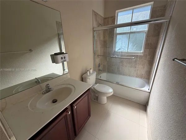 a bathroom with a bathtub sink and toilet