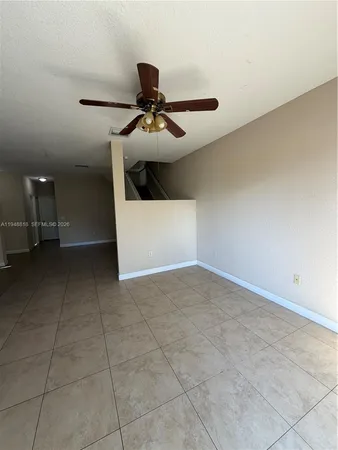 a kitchen with stainless steel appliances granite countertop a refrigerator and a stove