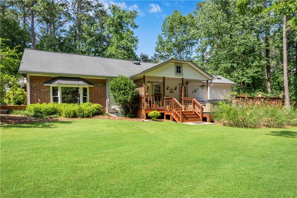 a view of a house with backyard porch and garden